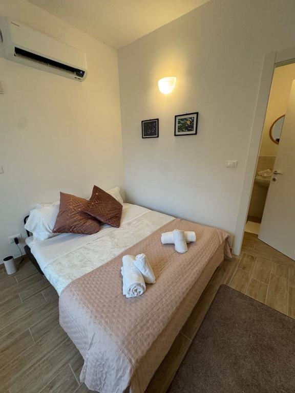 Postel nebo postele na pokoji v ubytování Albergo Tenco by Bottega