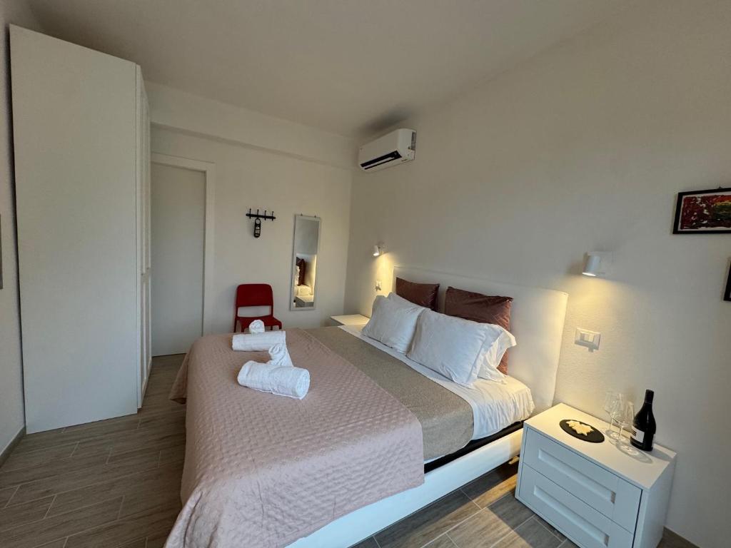 Postel nebo postele na pokoji v ubytování Albergo Tenco by Bottega