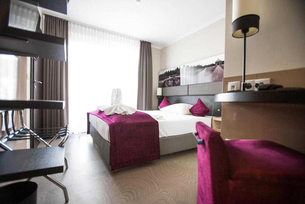 Postel nebo postele na pokoji v ubytování Amalienburg - Boutique & Boarding Hotel