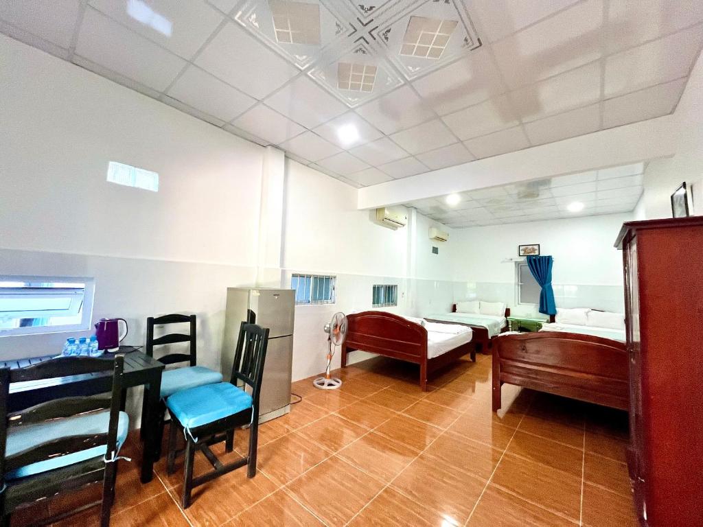 Giường trong phòng chung tại Minh Khoi Guest House