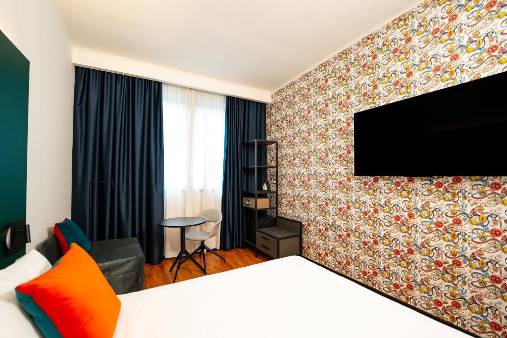 Televízia a/alebo spoločenská miestnosť v ubytovaní Mitico Hotel & Natural Spa