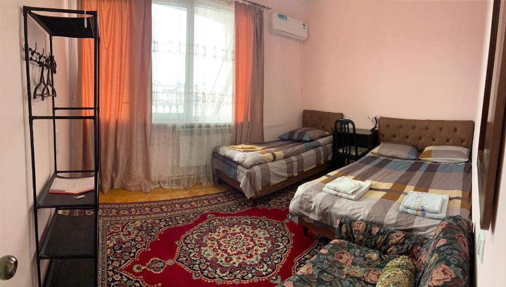 Postel nebo postele na pokoji v ubytování Guest House Lilia