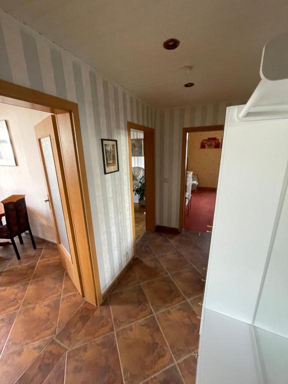 a hallway of a house with a tile floor at Ferienwohnung in Schmölln zentrale Lage in Schmölln