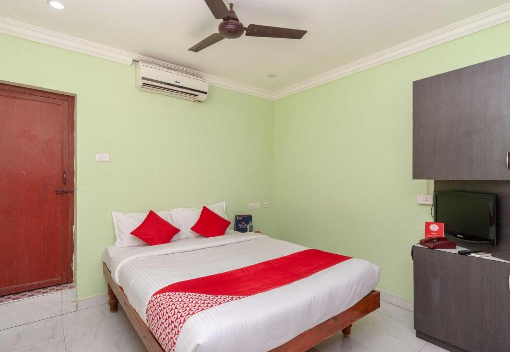 Postel nebo postele na pokoji v ubytování Hotel O Seabreeze Residency