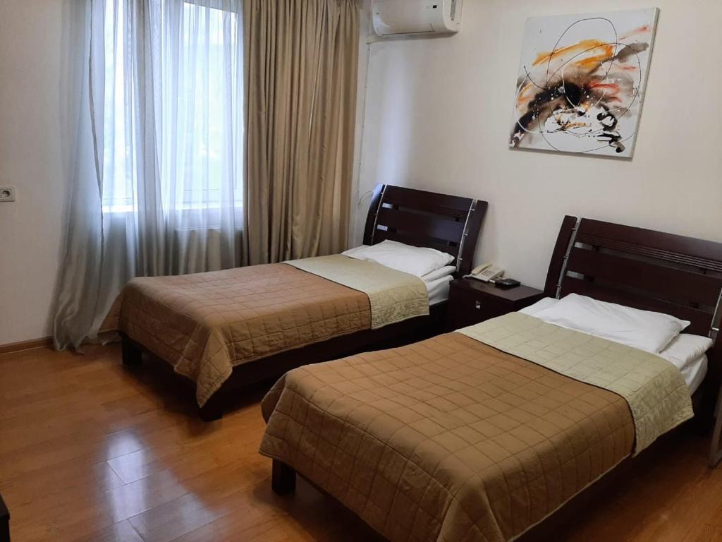 Postel nebo postele na pokoji v ubytování Hotel Grig
