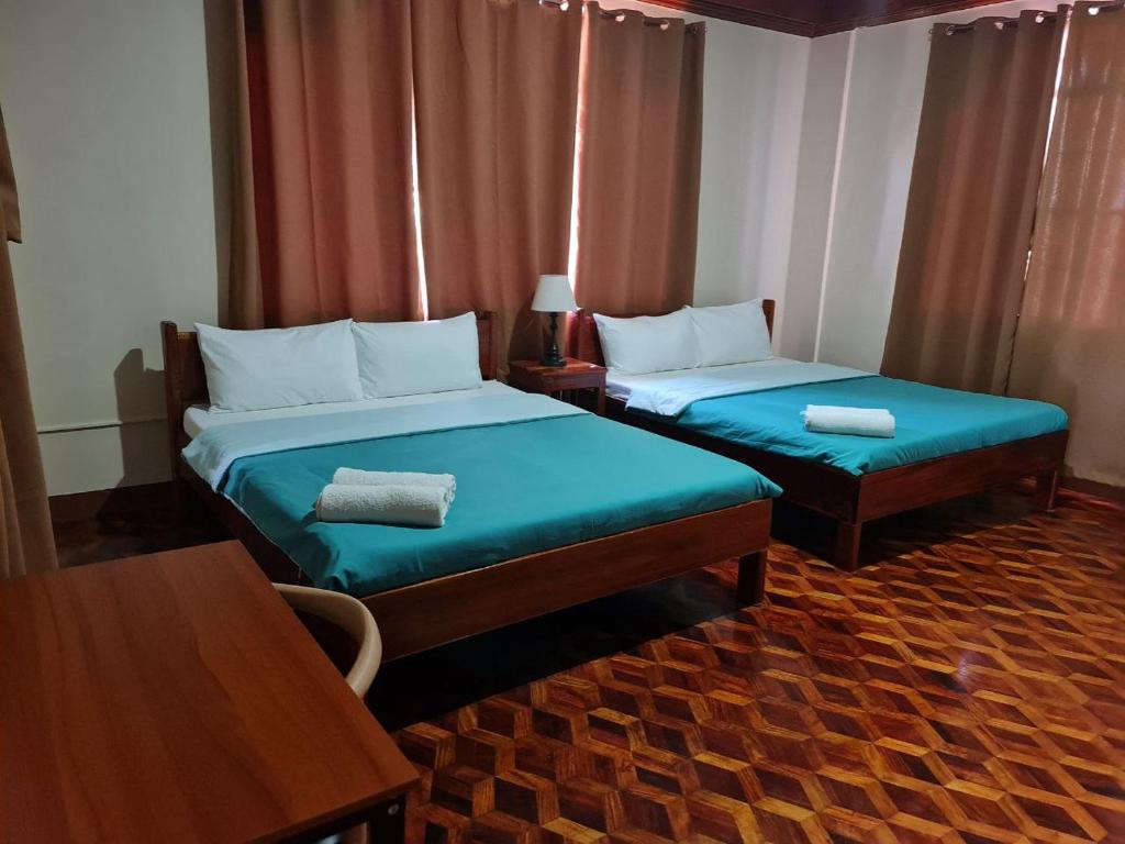 Postel nebo postele na pokoji v ubytování Alegria Hotel