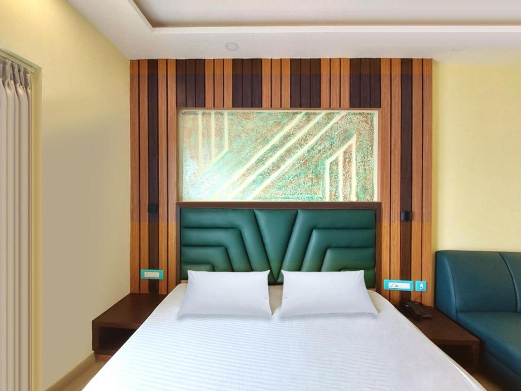 Postel nebo postele na pokoji v ubytování Sonargaon Beach Resort