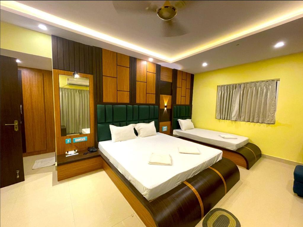 Postel nebo postele na pokoji v ubytování Sonargaon Beach Resort