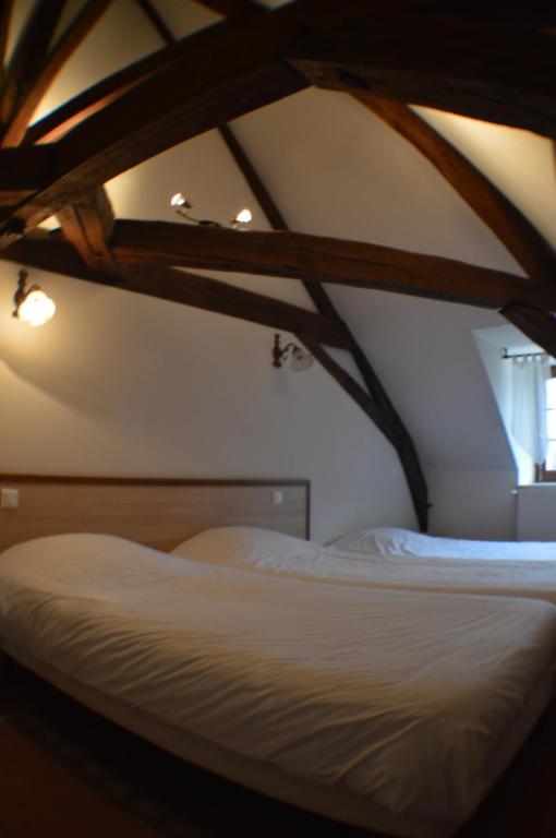 Postel nebo postele na pokoji v ubytování Le Relais du Morvan