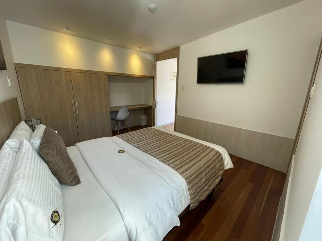 TV a/nebo společenská místnost v ubytování Casa Hotel Boyaca Real