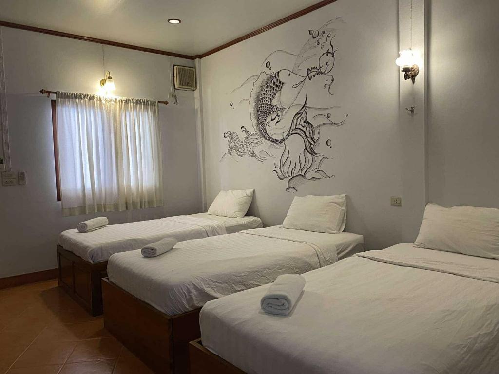 Postel nebo postele na pokoji v ubytování Old City Guest House