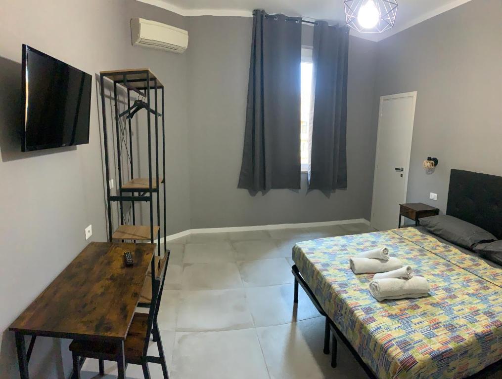 Postel nebo postele na pokoji v ubytování MARCONI 2 rooms