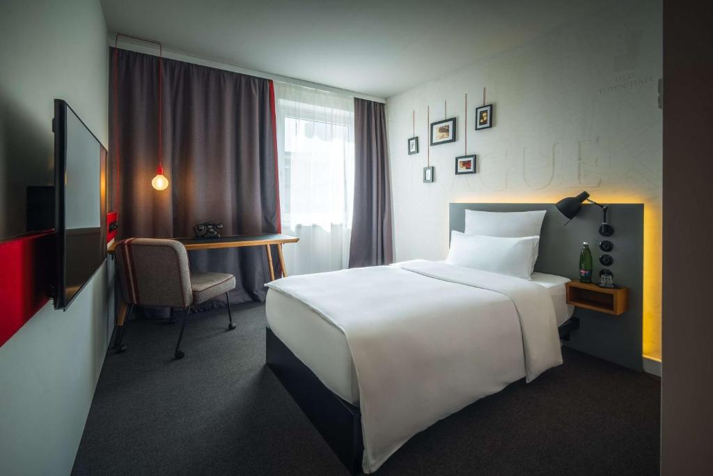 Postel nebo postele na pokoji v ubytování Pentahotel Prague