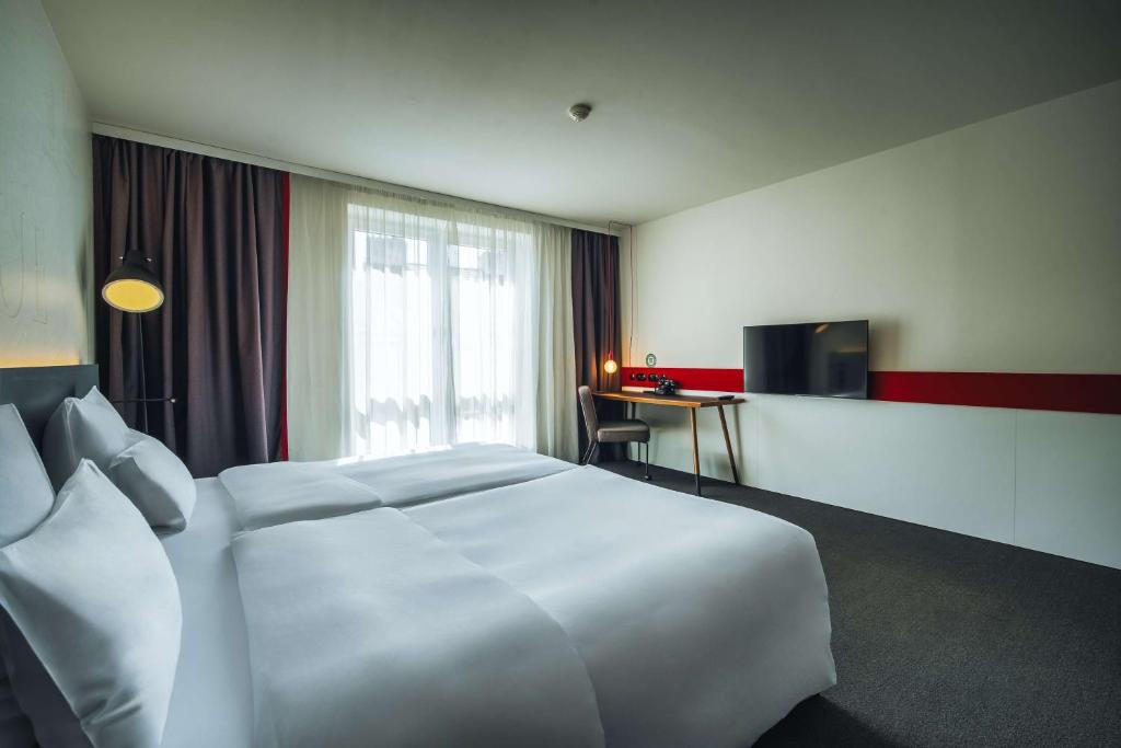 Postel nebo postele na pokoji v ubytování Pentahotel Prague