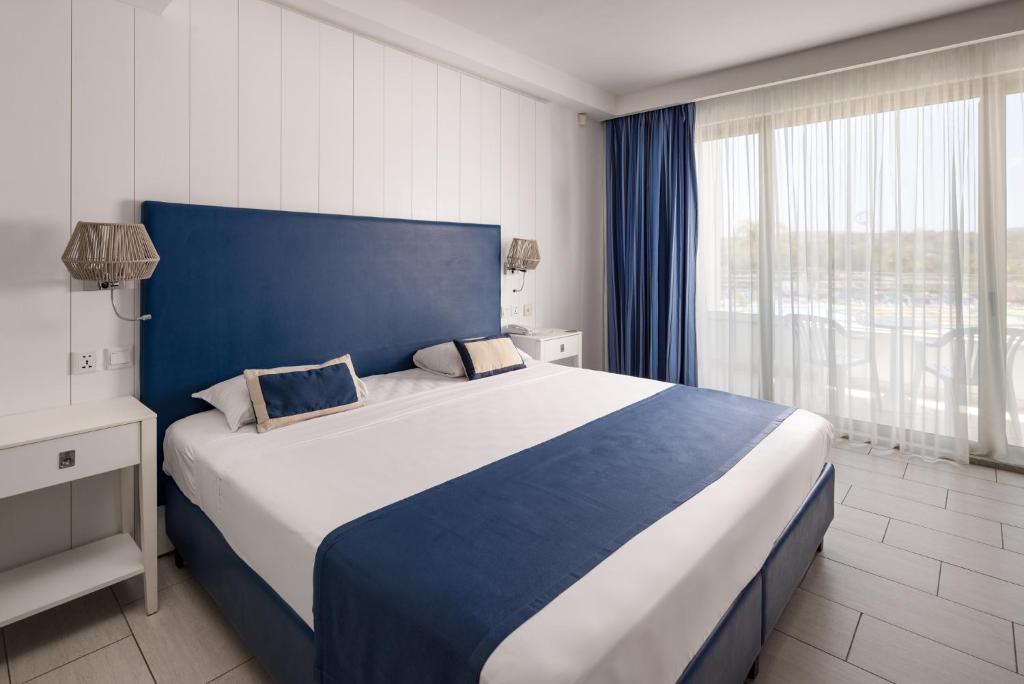 Postel nebo postele na pokoji v ubytování db Seabank Resort + Spa All Inclusive