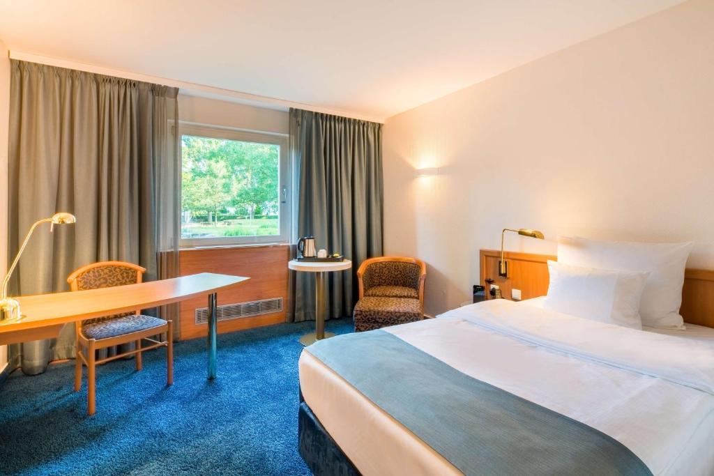 Postel nebo postele na pokoji v ubytování Best Western Plus Hotel Fellbach-Stuttgart