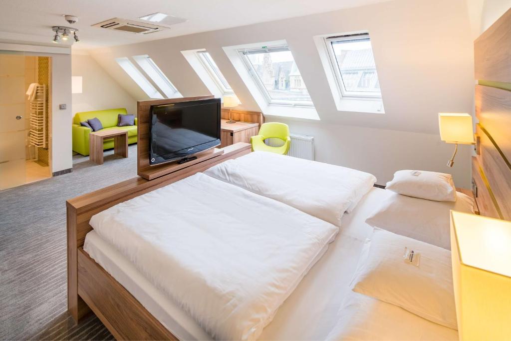 TV a/nebo společenská místnost v ubytování Best Western City Hotel Braunschweig