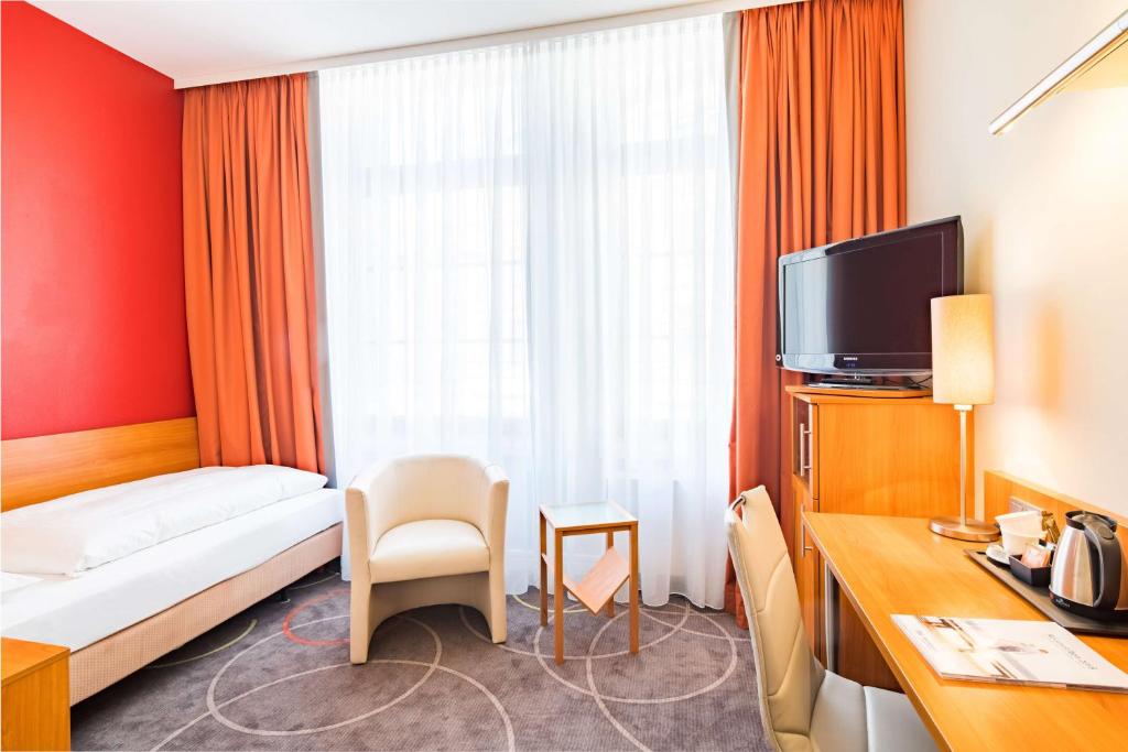 Postel nebo postele na pokoji v ubytování Best Western City Hotel Braunschweig