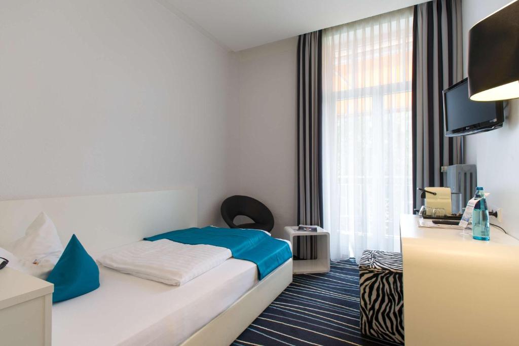 Postel nebo postele na pokoji v ubytování Sure Hotel by Best Western Bad Dürrheim