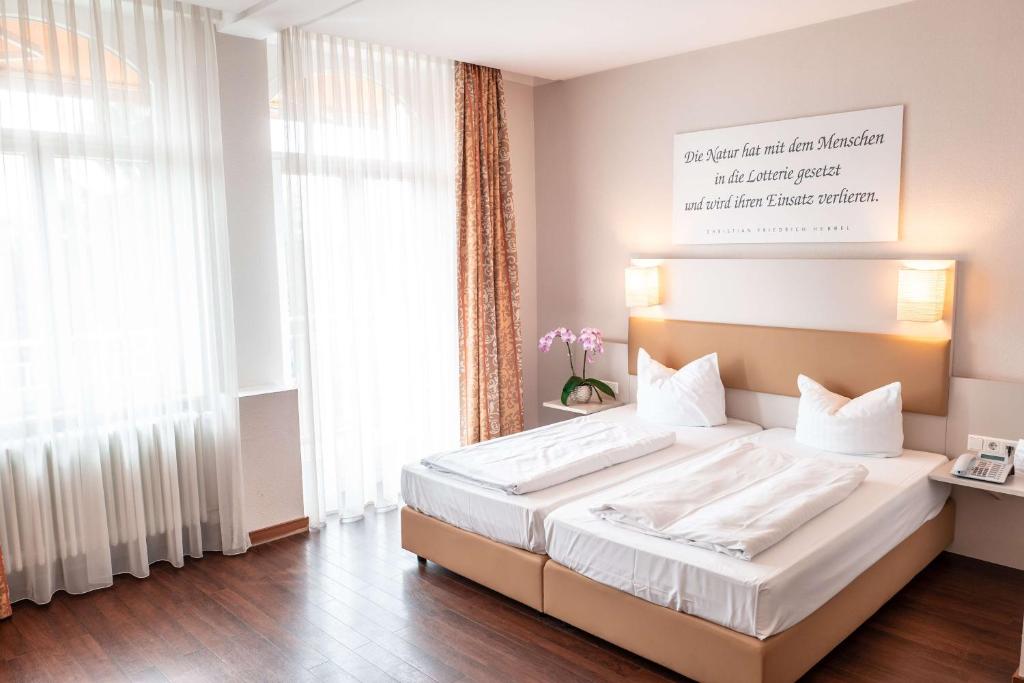 Postel nebo postele na pokoji v ubytování Sure Hotel by Best Western Bad Dürrheim