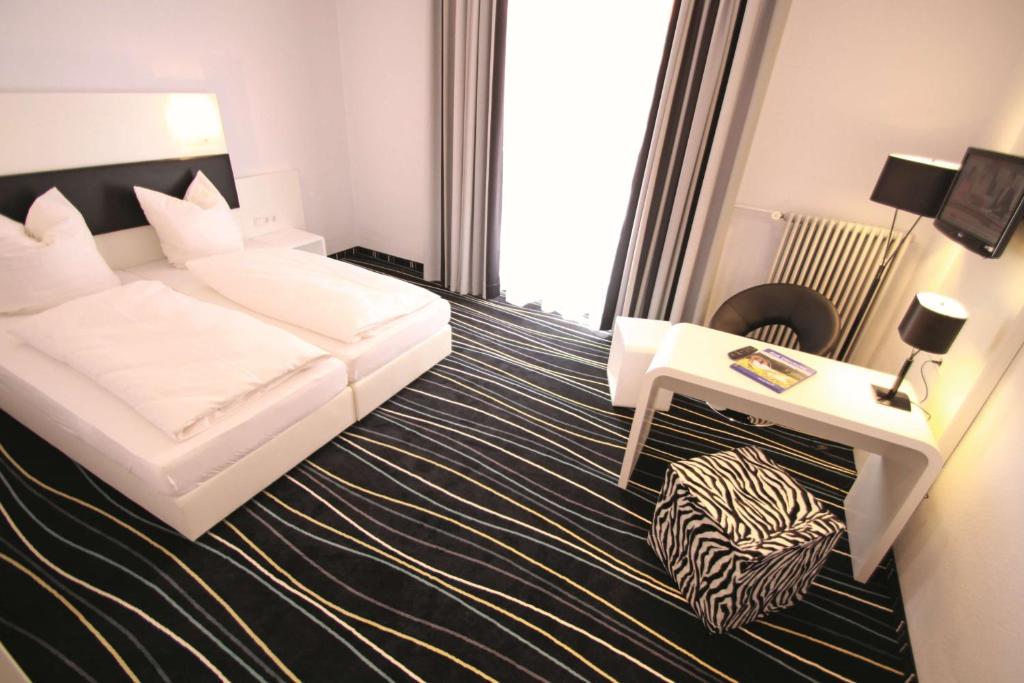 Postel nebo postele na pokoji v ubytování Sure Hotel by Best Western Bad Dürrheim