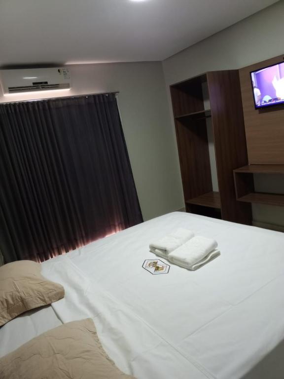 Postel nebo postele na pokoji v ubytování Hotel dos Reis