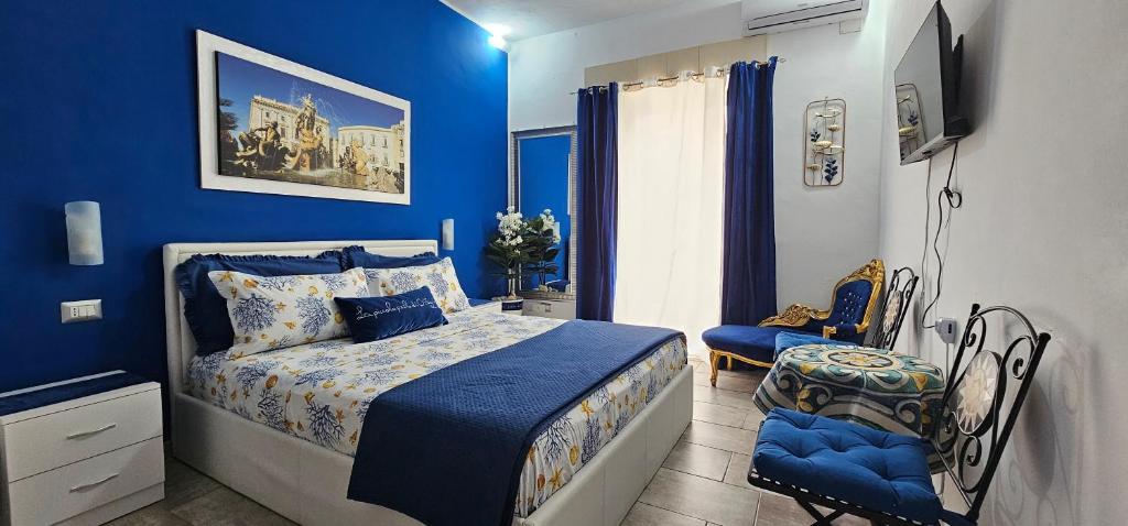 Posteľ alebo postele v izbe v ubytovaní La Piccola Perla di Ortigia