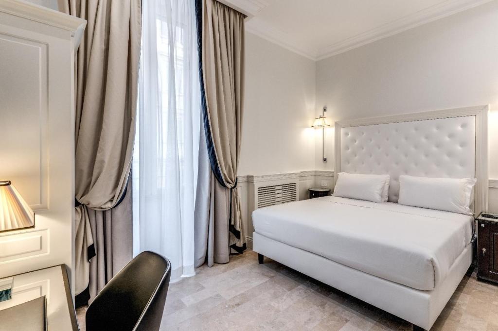 Postel nebo postele na pokoji v ubytování ACA Hotel Viminale