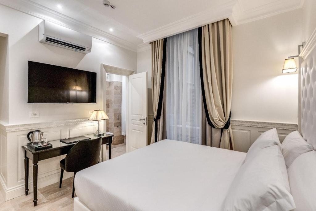 Postel nebo postele na pokoji v ubytování ACA Hotel Viminale