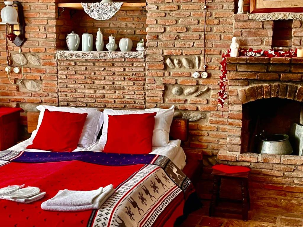 Postel nebo postele na pokoji v ubytování Dzveli Galavani -Old Wall
