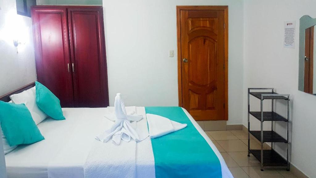 Postel nebo postele na pokoji v ubytování Hostal Sir Francis Drake
