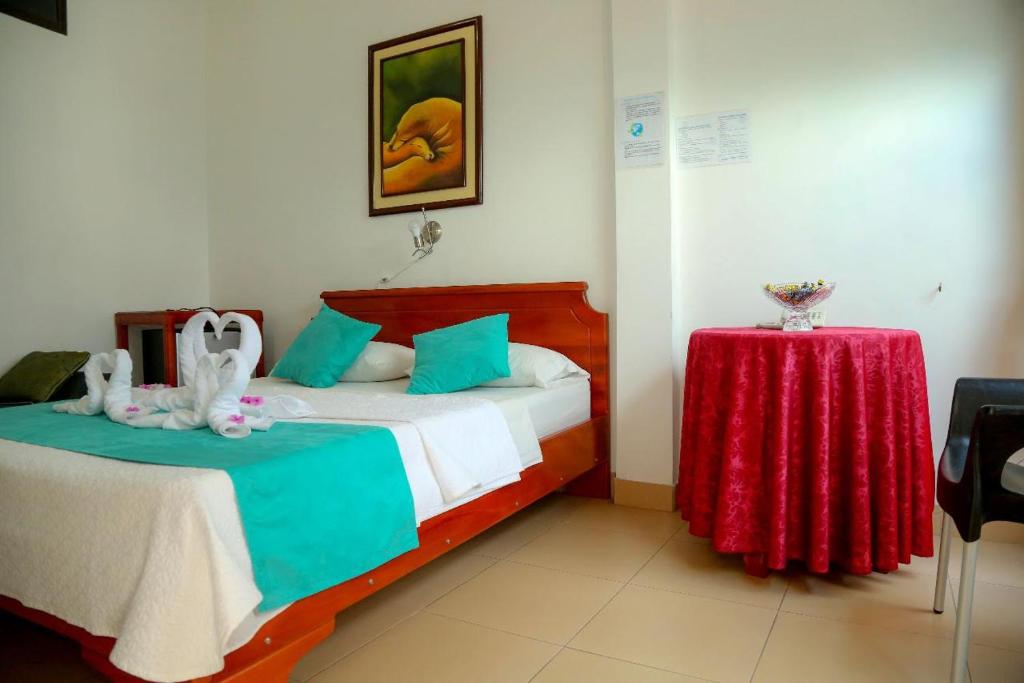 Postel nebo postele na pokoji v ubytování Hostal Sir Francis Drake