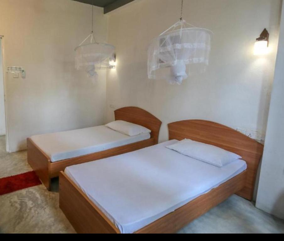 Postel nebo postele na pokoji v ubytování Holiday Inn Unawatuna