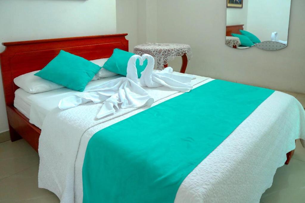 Postel nebo postele na pokoji v ubytování Hostal Sir Francis Drake