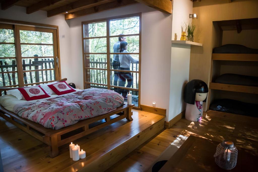 Postel nebo postele na pokoji v ubytování La Cabane Zen