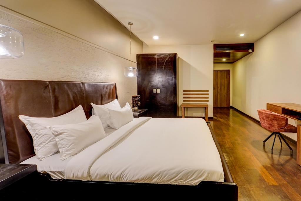 Postel nebo postele na pokoji v ubytování Palette - The Slate Hotel Nungambakkam