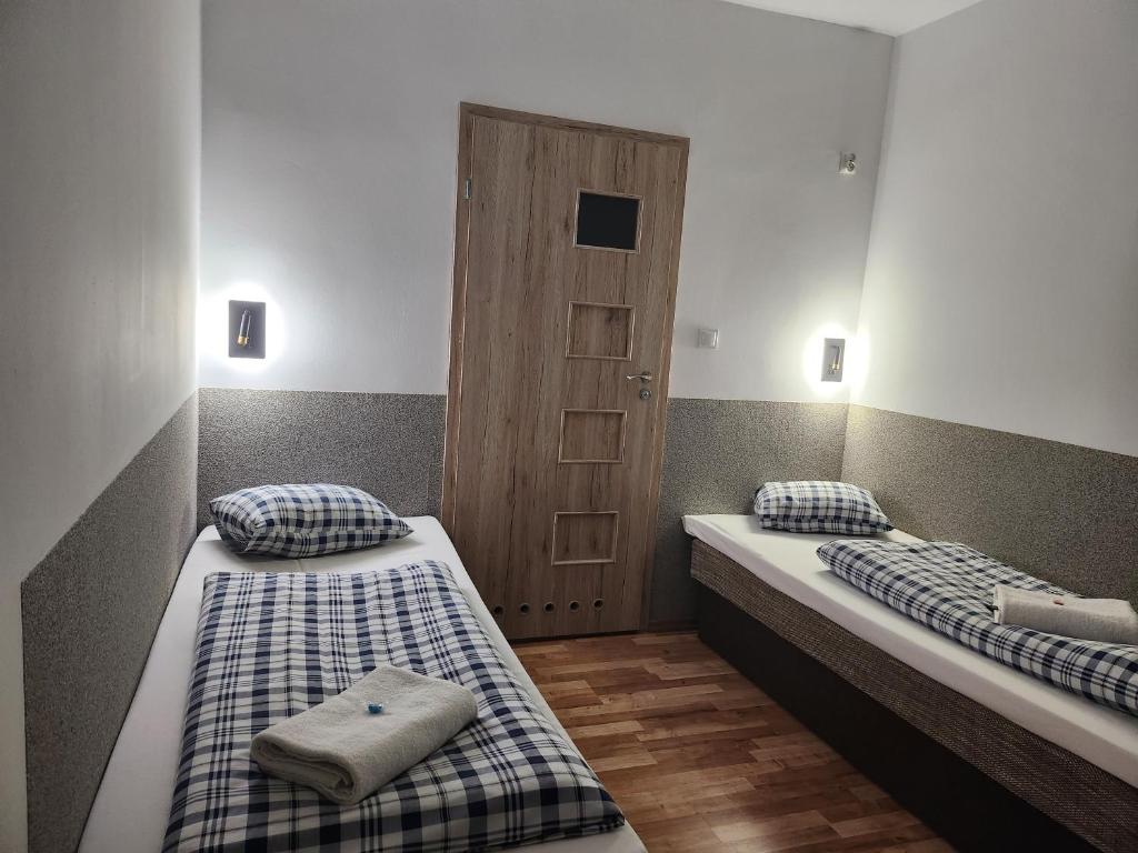 Postel nebo postele na pokoji v ubytování Gościnna Hacjenda