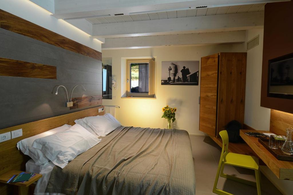 Кровать или кровати в номере Resort Il Gallo Senone