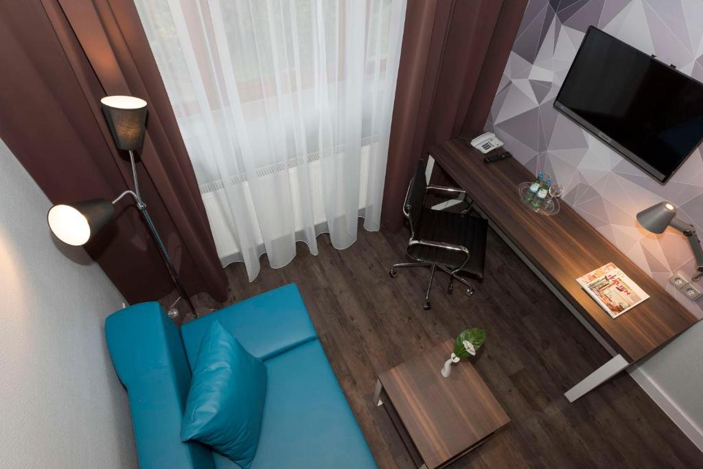 TV a/nebo společenská místnost v ubytování Best Western Hotel Braunschweig Seminarius