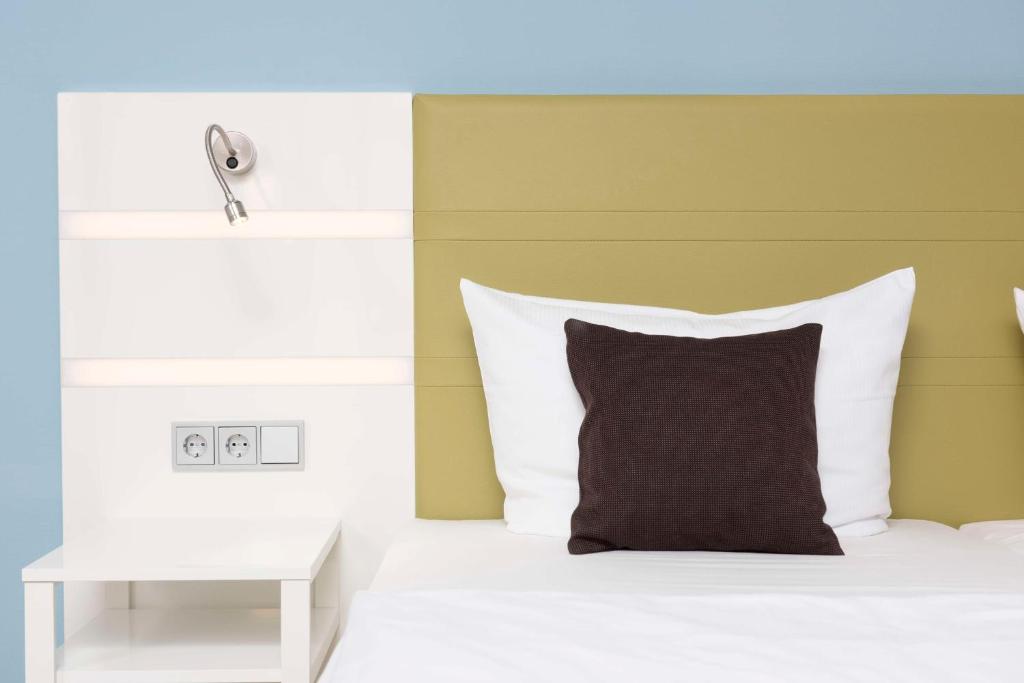 Postel nebo postele na pokoji v ubytování Best Western Hotel Peine Salzgitter