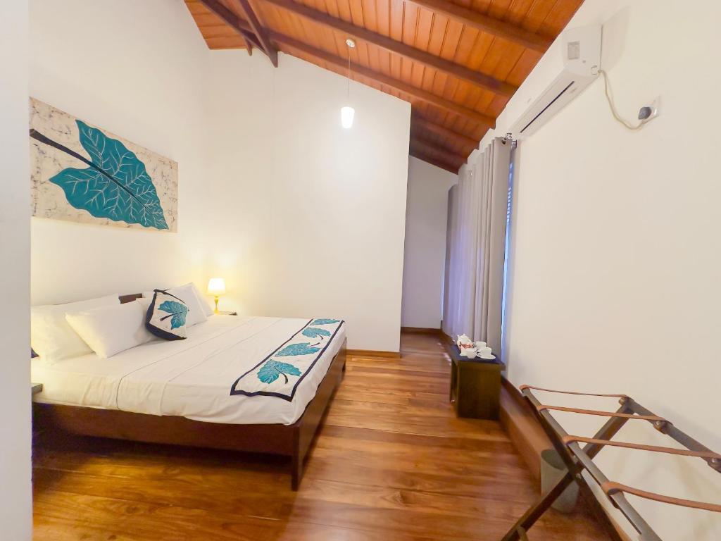 Postel nebo postele na pokoji v ubytování Deer Hill Rest Kandy