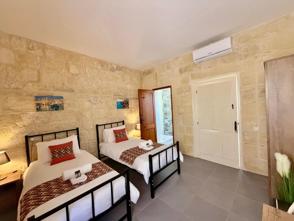 Postel nebo postele na pokoji v ubytování Ta' Matmura B&B
