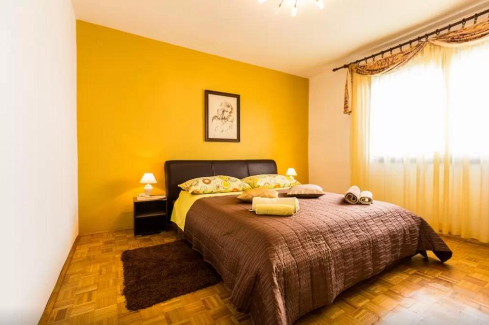 Posteľ alebo postele v izbe v ubytovaní Apartment Maraska