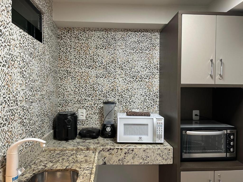 Kuchyň nebo kuchyňský kout v ubytování Tabatinga Flat - Beira Mar