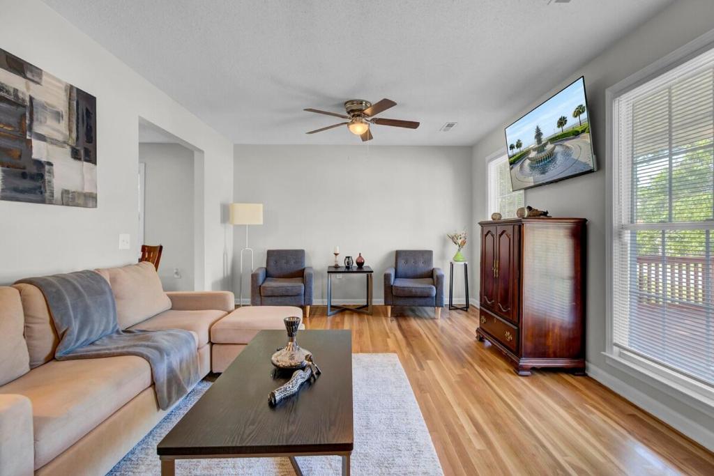 a living room with a couch and a table at Charleston, near Airport, luxury and cozy house in Ladson
