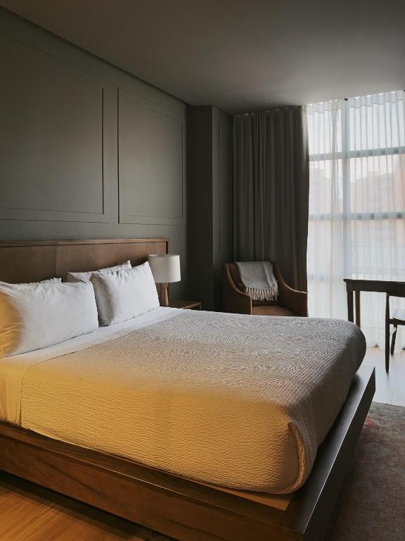 Postel nebo postele na pokoji v ubytování Hotel Coco