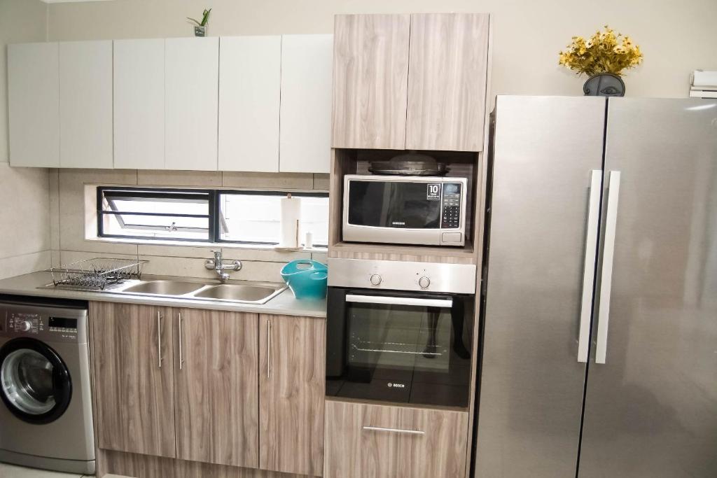 Kuchyň nebo kuchyňský kout v ubytování Making Memories Apartment