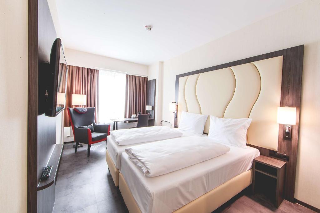 Postel nebo postele na pokoji v ubytování Best Western Plaza Hotel Mannheim