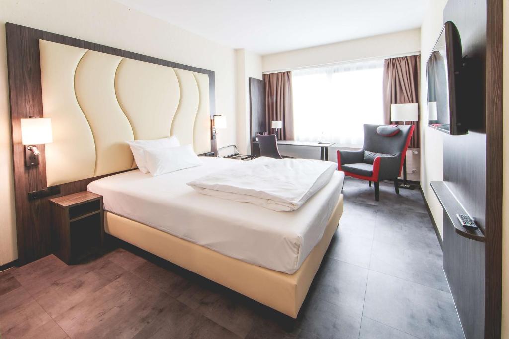 Postel nebo postele na pokoji v ubytování Best Western Plaza Hotel Mannheim