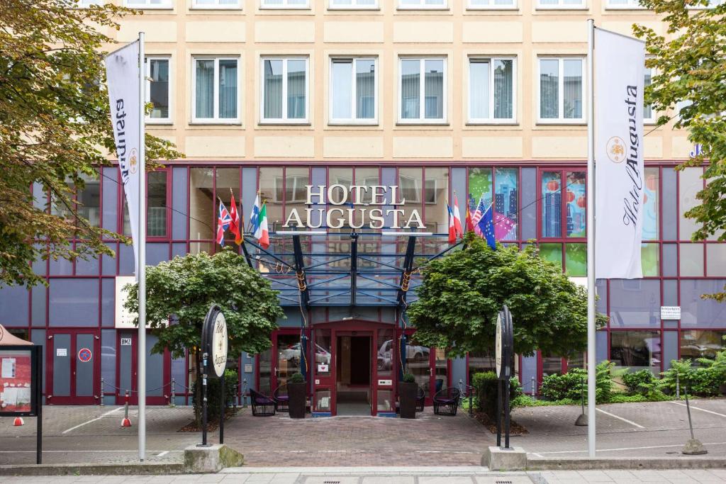 a hotel australia with flags in front of it at Best Western Hotel Augusta in Augsburg